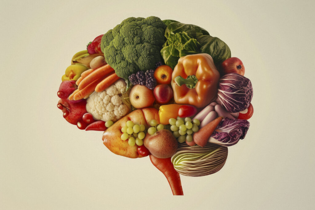 Cerveau composé de fruits et légumes colorés, illustrant le lien entre alimentation et axe intestin-cerveau